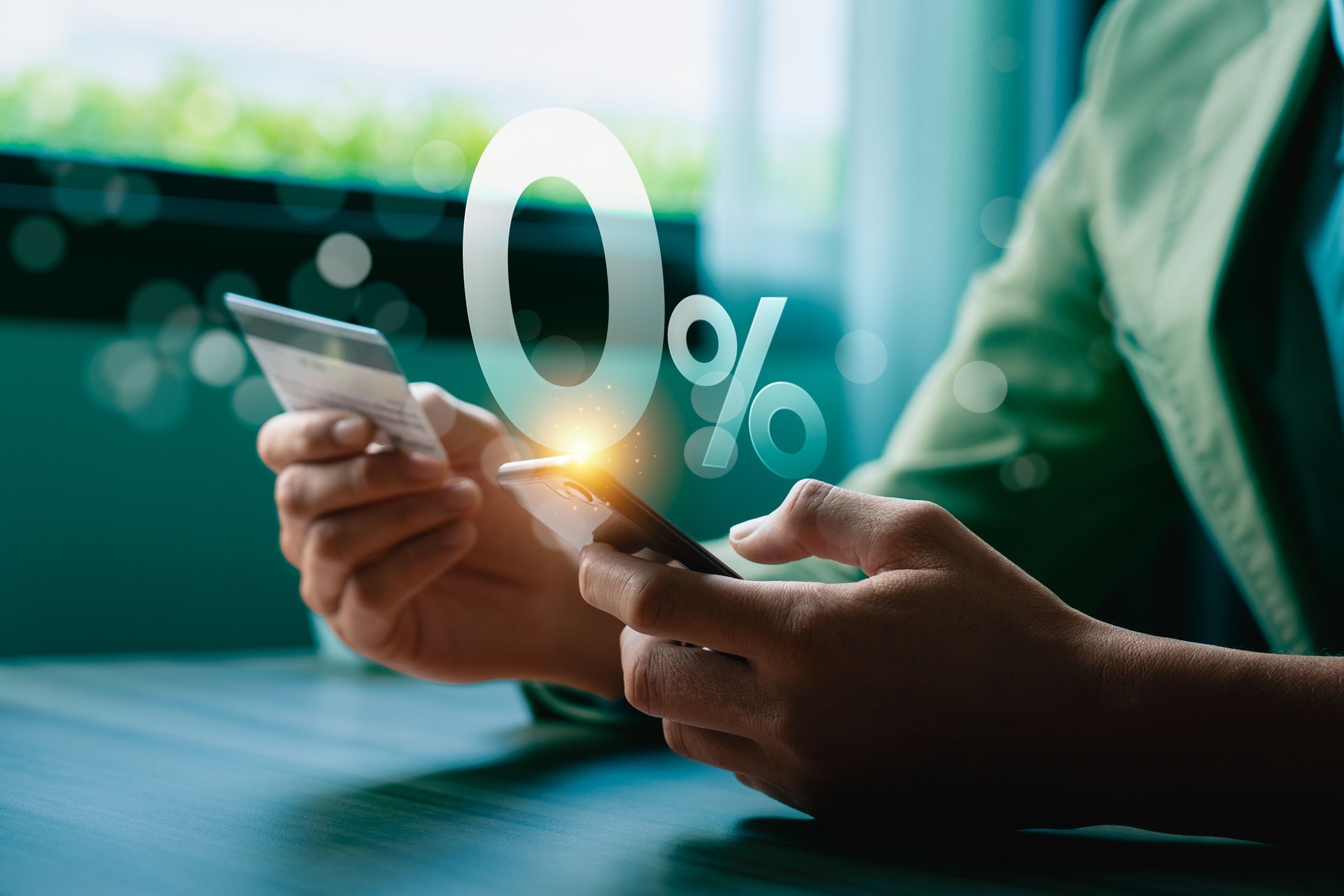 Hands Holding Smartphone and Credit Card with 0% Interest Symbol, Highlighting Digital Payment, Online Shopping, Cashback Offers, Financial Promotions, and Modern Consumer Convenience Concepts