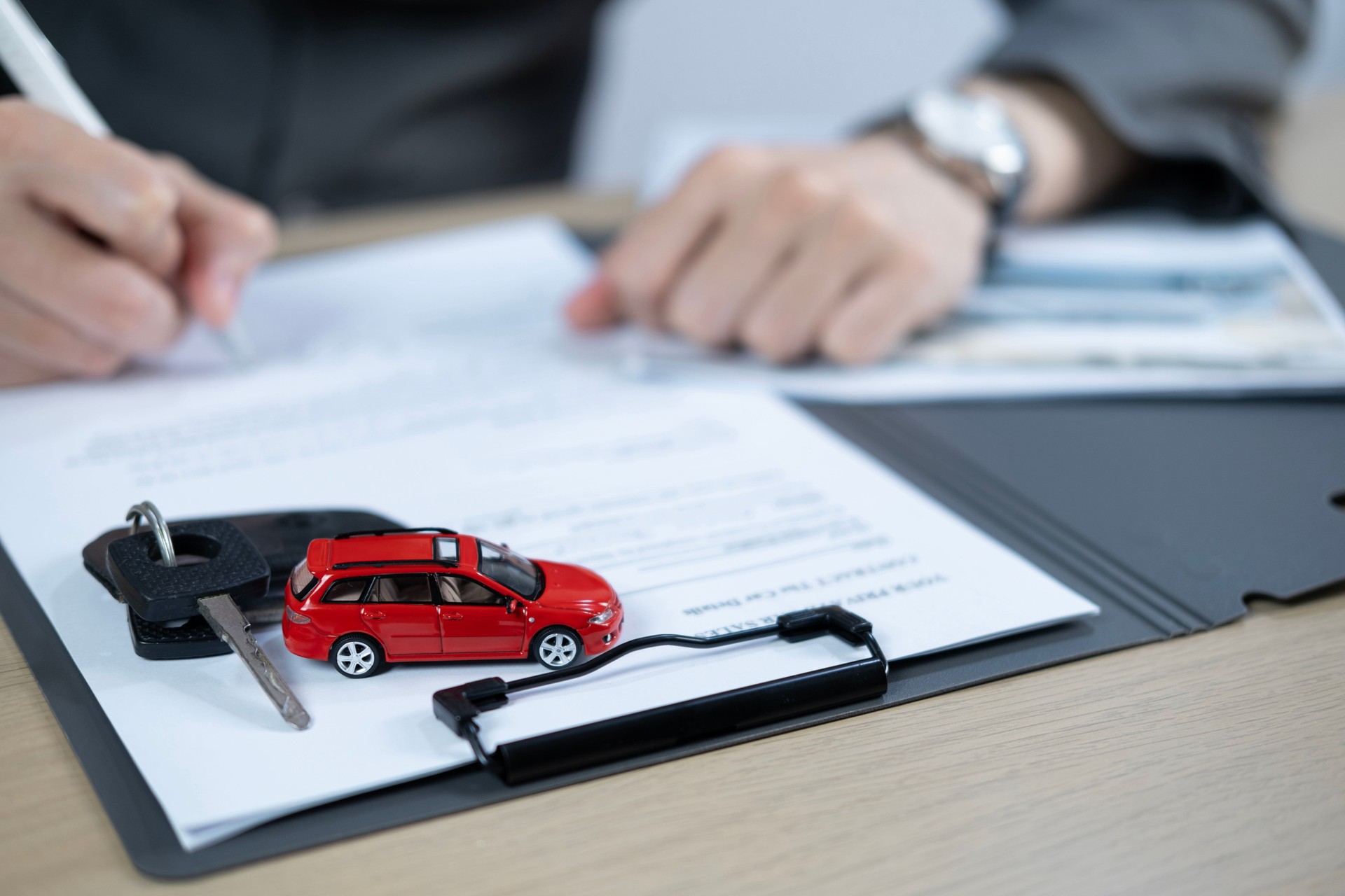 Dealership offered various finance options, including an auto loan or lease, making it easier to buy or rent a car from the company. Agent reviewed contract, finalizing insurance agreement.